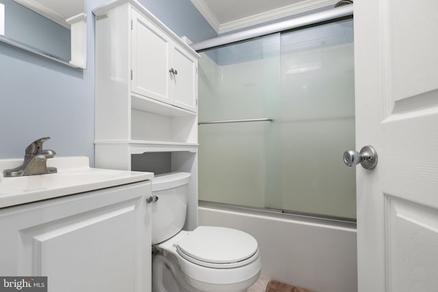 full bathroom featuring combined bath / shower with glass door, vanity, toilet, and crown molding