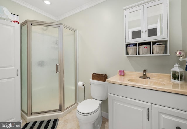 bathroom featuring tile patterned floors, crown molding, toilet, a shower with door, and vanity