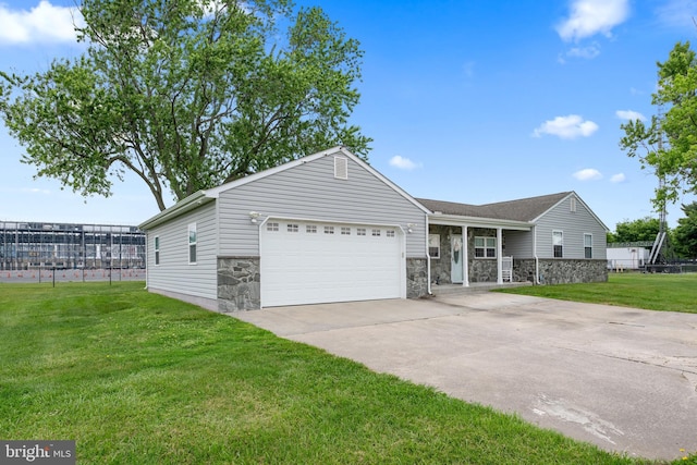 ranch-style home with a front lawn and a garage