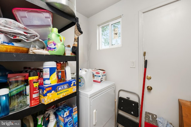 clothes washing area featuring washer / dryer