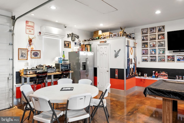 interior space featuring a wall mounted air conditioner, wood-type flooring, and billiards