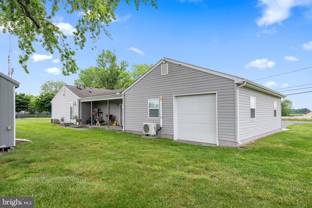 back of house with ac unit and a lawn