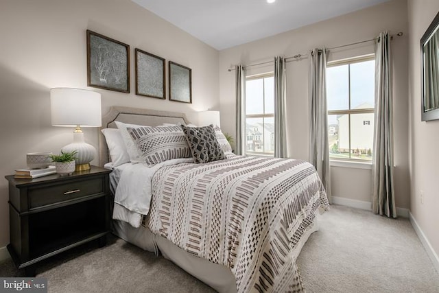 bedroom featuring light colored carpet