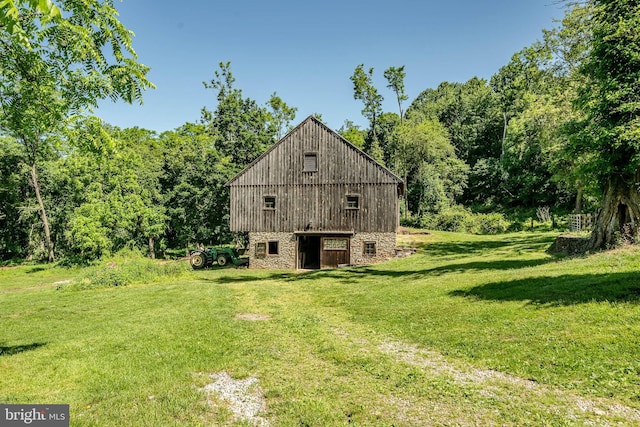 view of side of home featuring a lawn