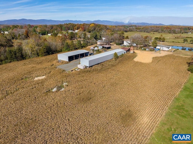 drone / aerial view with a mountain view and a rural view