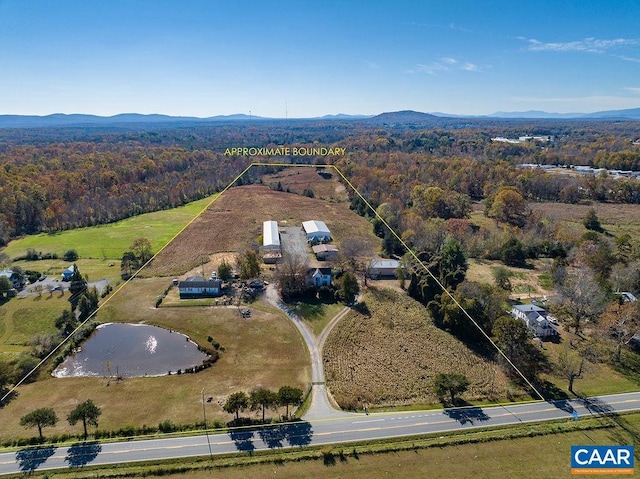 bird's eye view with a water and mountain view