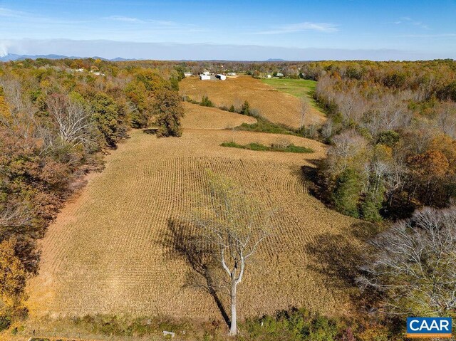 birds eye view of property with a rural view