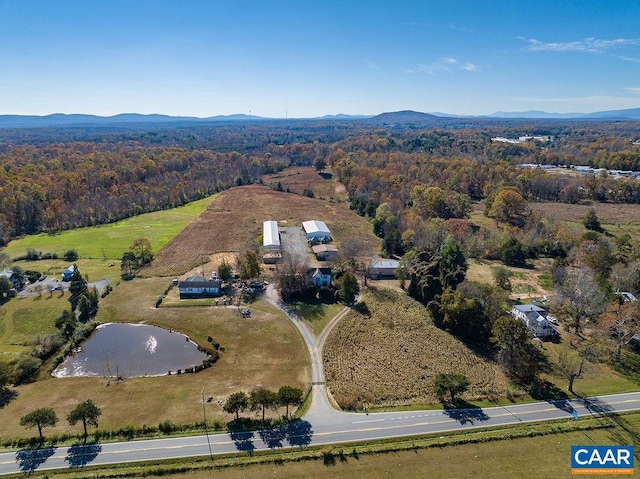 drone / aerial view with a water and mountain view