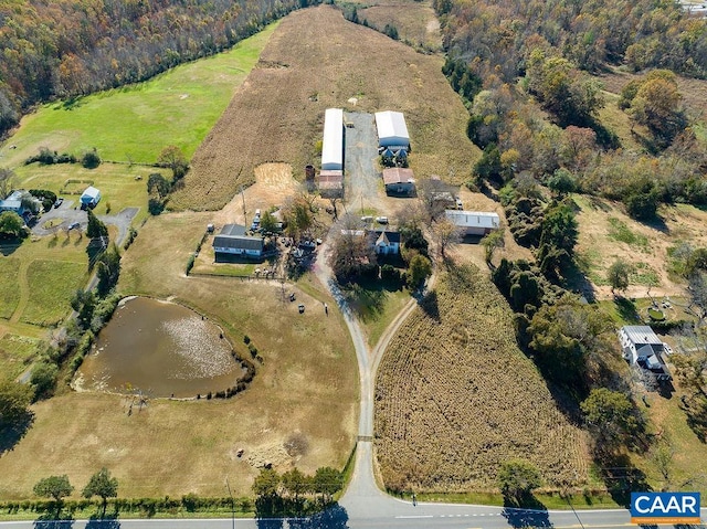 birds eye view of property featuring a rural view and a water view