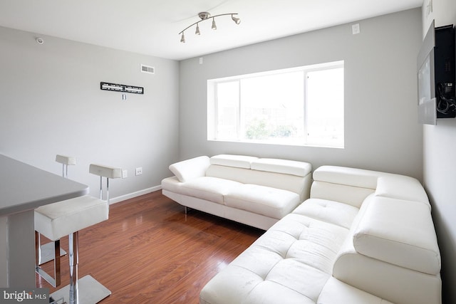 living room featuring dark hardwood / wood-style flooring