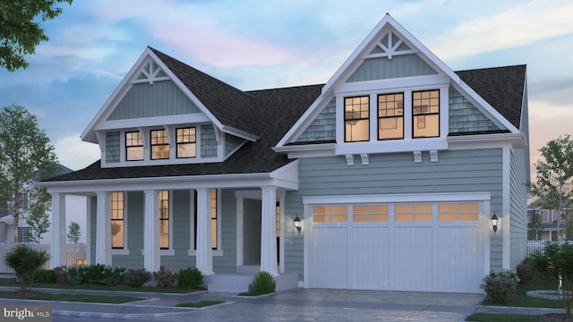 view of front facade with a porch and a garage