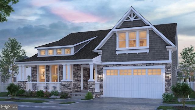 craftsman-style house with covered porch and a garage