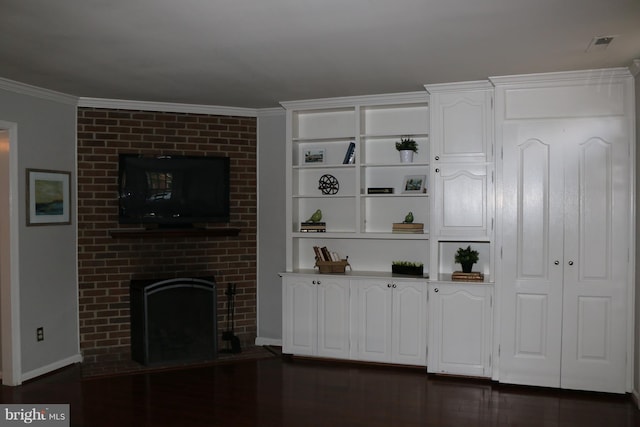 unfurnished living room with a fireplace, dark wood-type flooring, and ornamental molding