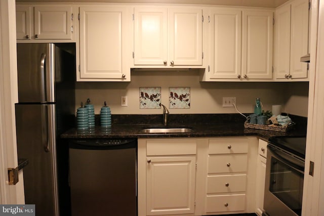 kitchen with white cabinets and appliances with stainless steel finishes