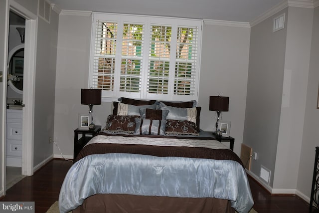 bedroom with ornamental molding and dark wood-type flooring