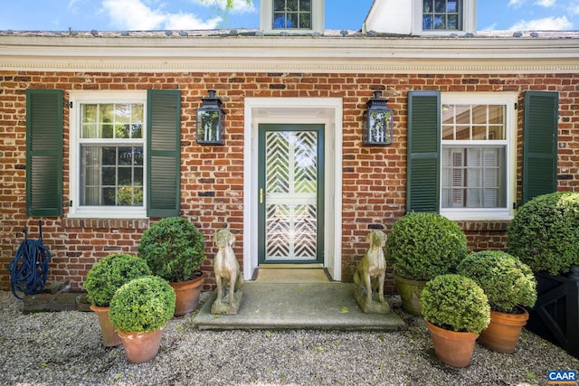 entrance to property with brick siding