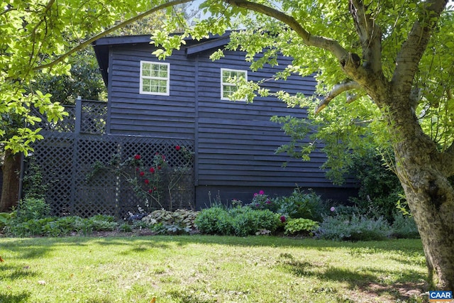 view of home's exterior with a yard