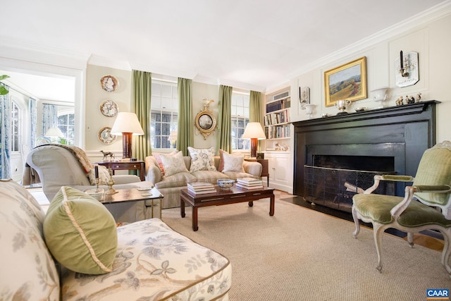 living room with a fireplace with flush hearth, crown molding, and built in features