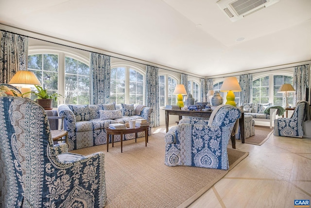 living room featuring visible vents and wood finished floors