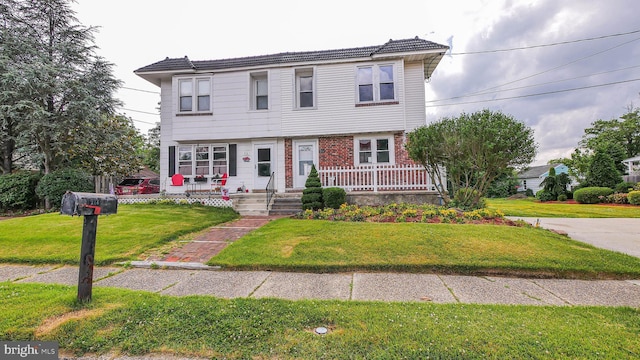 view of front of home with a front yard