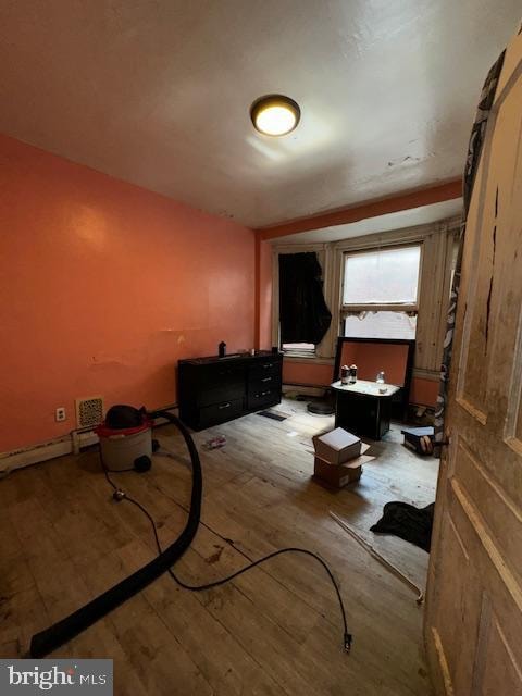 miscellaneous room featuring wood-type flooring