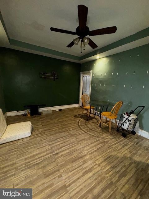 unfurnished room featuring hardwood / wood-style floors and ceiling fan