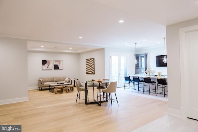 dining space featuring light wood-type flooring