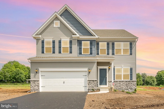 craftsman house with a garage