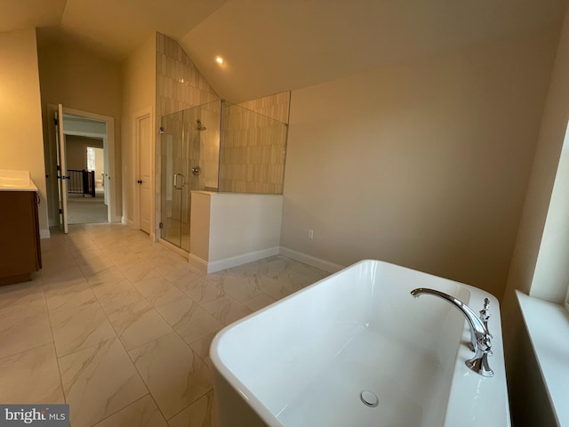 bathroom featuring vanity, separate shower and tub, and lofted ceiling