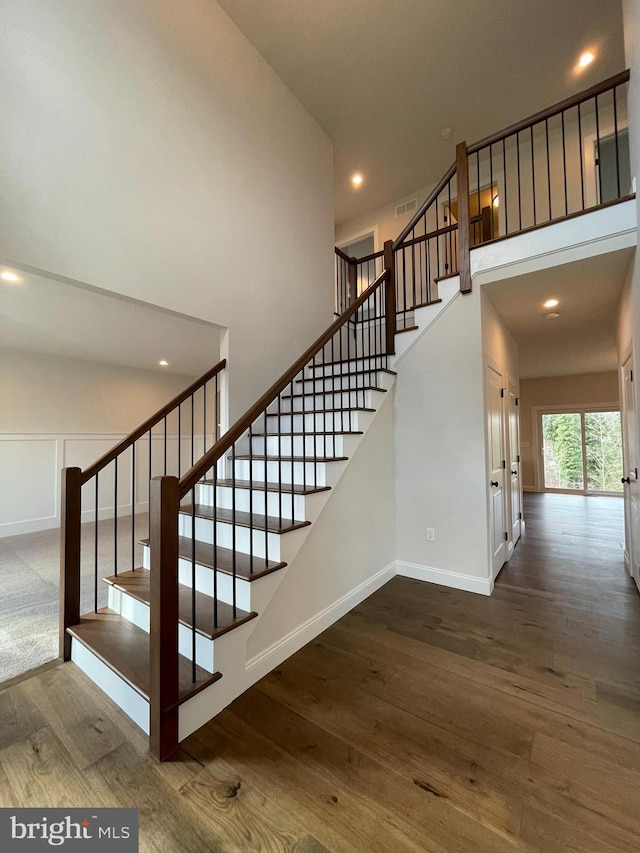 staircase featuring hardwood / wood-style floors