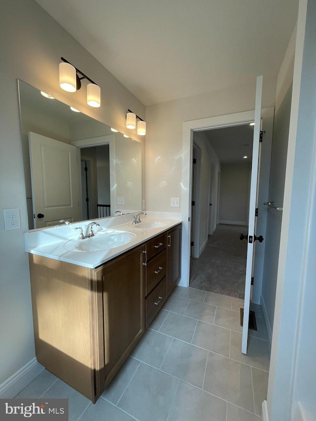 bathroom with tile patterned flooring and vanity