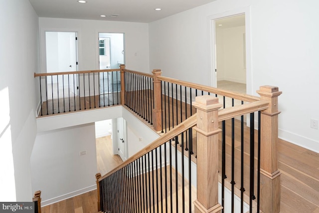 stairway featuring hardwood / wood-style flooring