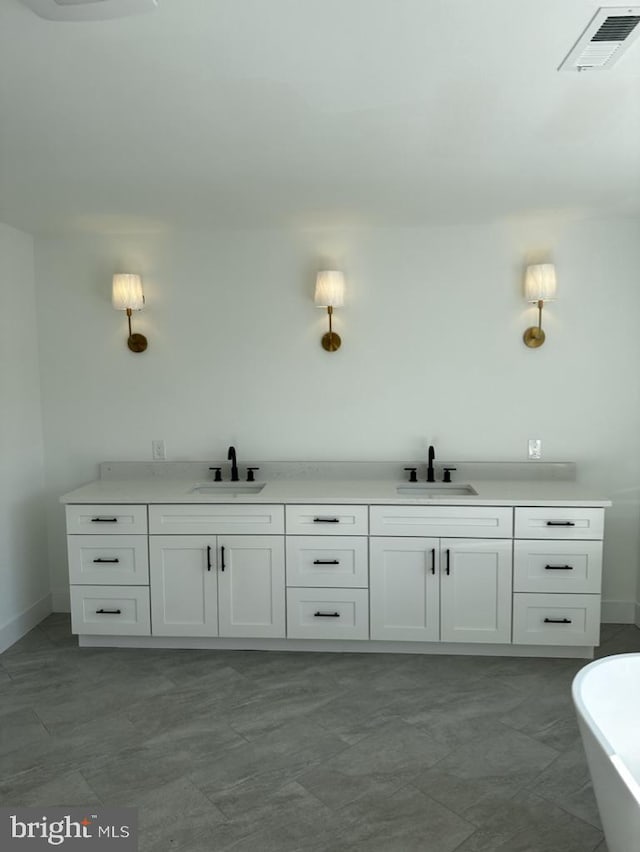 bathroom featuring a bathing tub and vanity