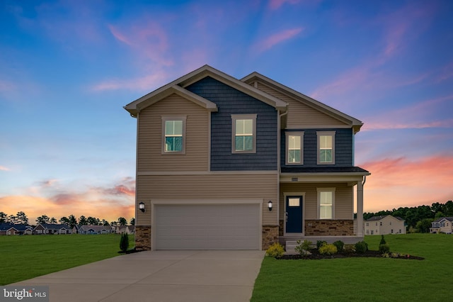 view of front facade featuring a yard and a garage