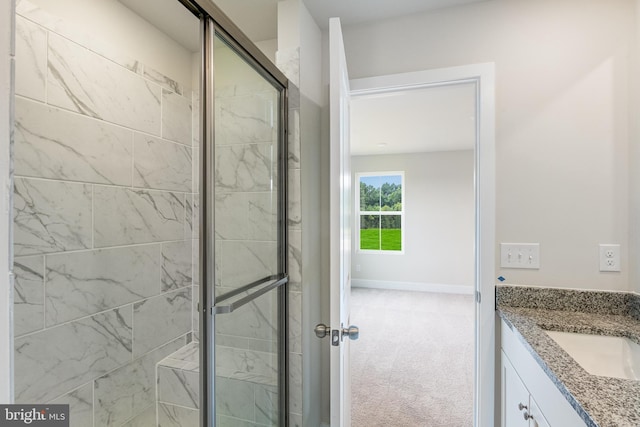 bathroom with vanity and walk in shower