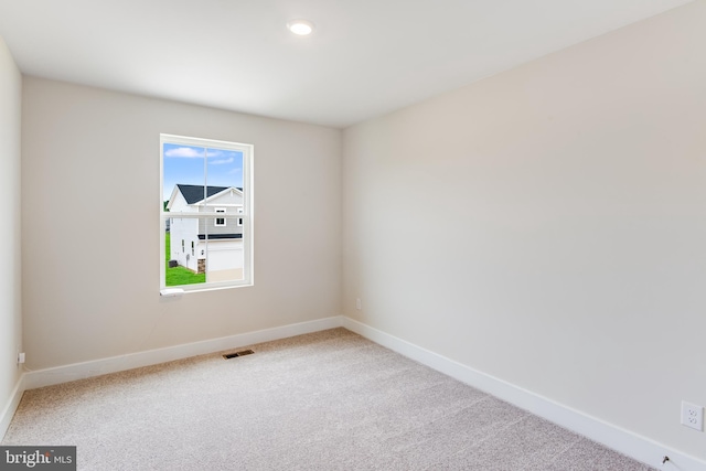 unfurnished room with carpet floors