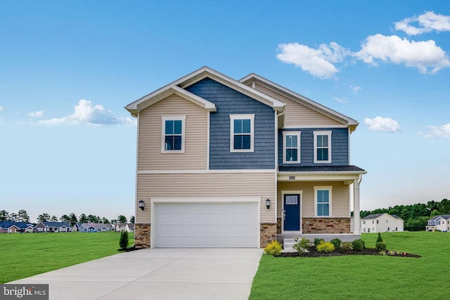 view of front of house featuring a garage and a front lawn