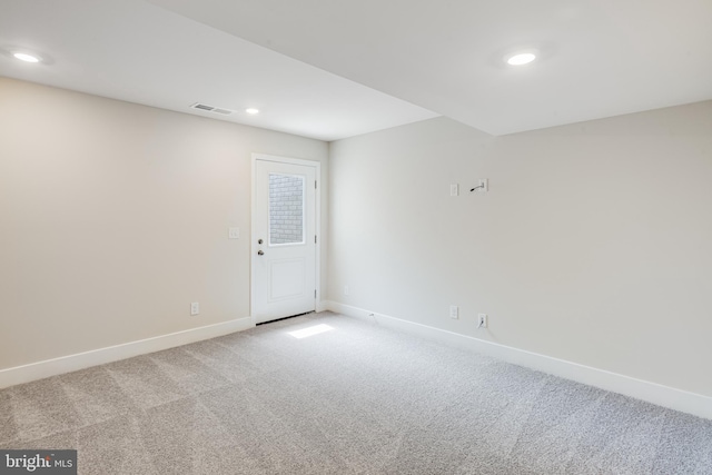 spare room with light carpet