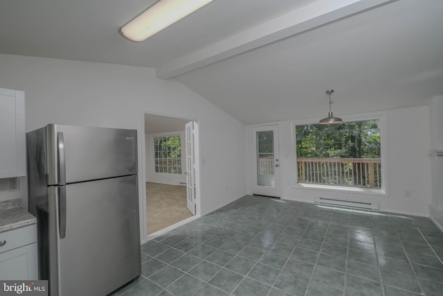 kitchen with lofted ceiling with beams, a baseboard heating unit, stainless steel fridge, pendant lighting, and white cabinets