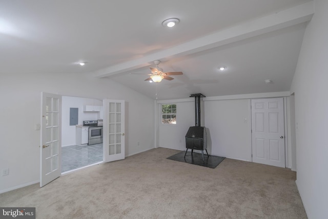 interior space with vaulted ceiling with beams, french doors, light colored carpet, and electric panel