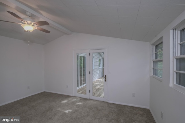 carpeted empty room with vaulted ceiling with beams and ceiling fan