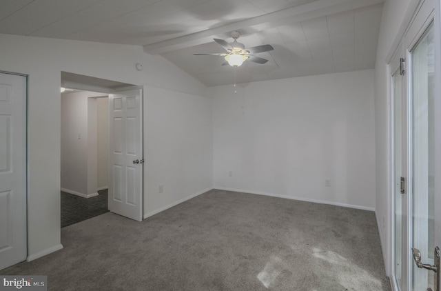 unfurnished bedroom with ceiling fan, lofted ceiling with beams, and carpet floors