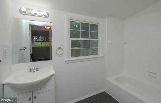 bathroom with bathtub / shower combination and vanity