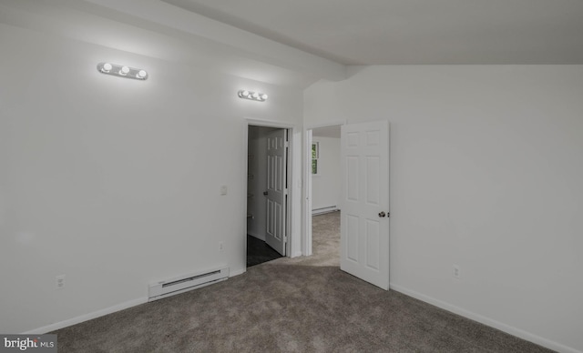 spare room featuring dark colored carpet, vaulted ceiling with beams, and a baseboard radiator