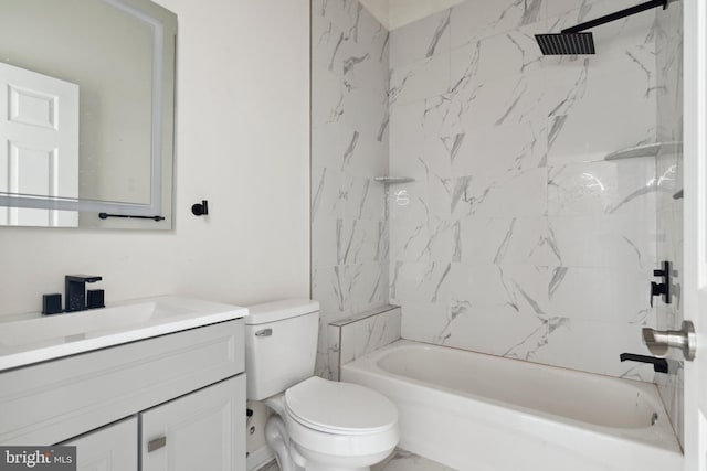 full bathroom featuring vanity, tiled shower / bath combo, and toilet