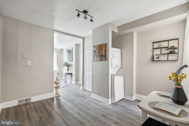 corridor with hardwood / wood-style flooring