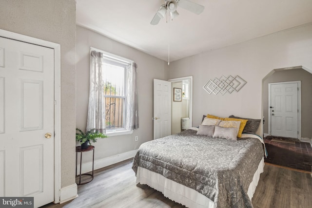 bedroom with ceiling fan and hardwood / wood-style flooring