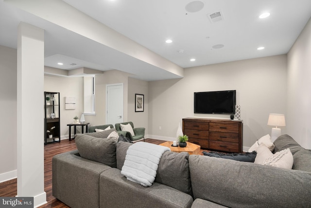 living room with dark hardwood / wood-style flooring