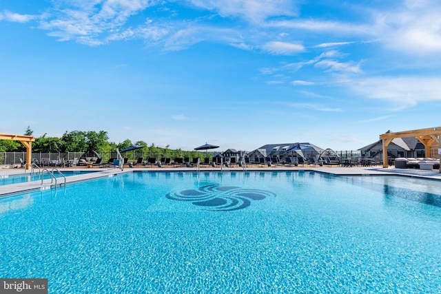 view of swimming pool with a pergola