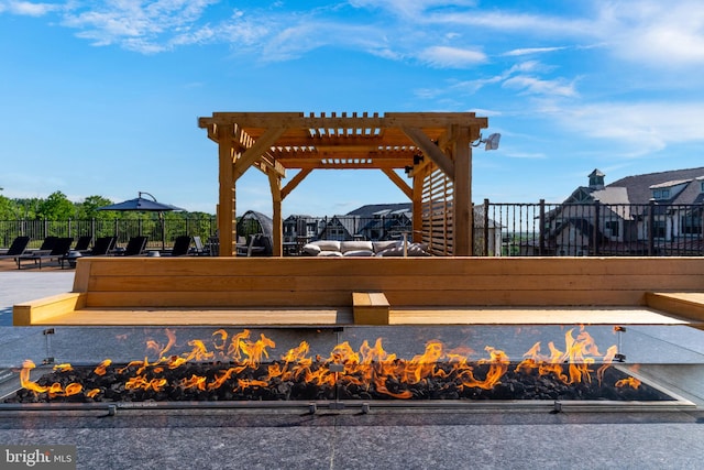 view of home's community with a gazebo, a fire pit, and a pergola